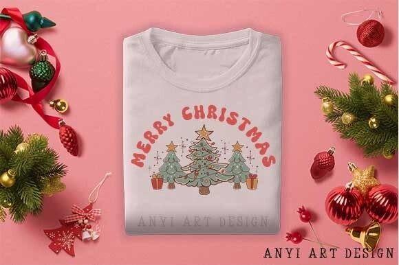 Christmas Tree PNG Designs for Sublimation on a folded white t-shirt with holiday decorations around