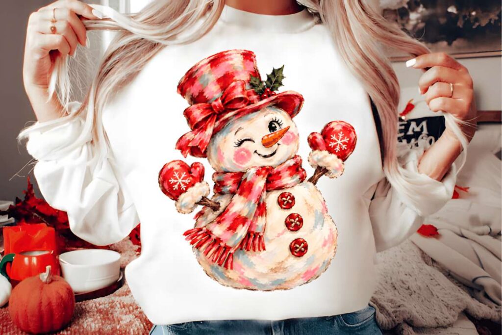 Christmas t-shirt design ideas for POD sellers featuring a brushstroke-style snowman with a red hat and scarf