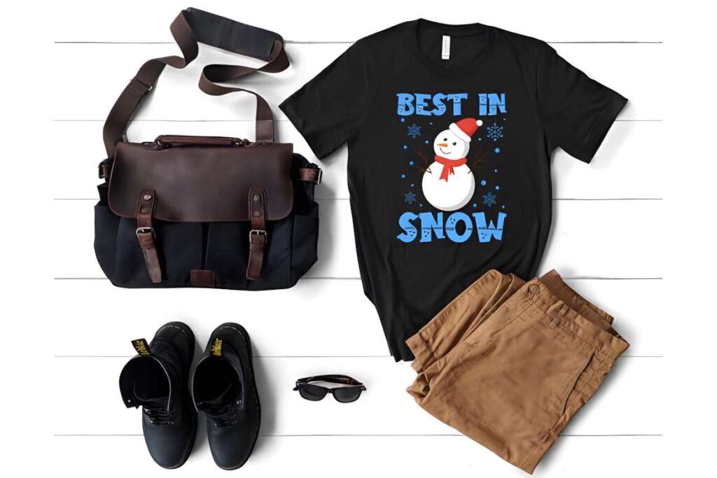 Black Christmas t-shirt with snowman and text Best in Snow, paired with — Christmas T-shirt design ideas for POD sellers