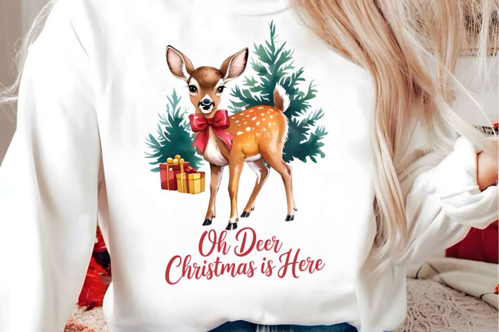 Christmas t-shirt design ideas for POD sellers featuring a cute deer with a red bow and Christmas trees